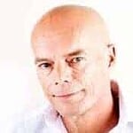 Close-up of a bald man with a neutral expression